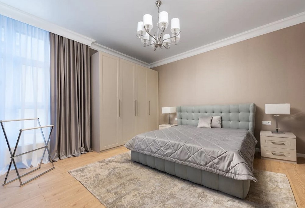 Light colored bedroom interior, beige, browns and light greens