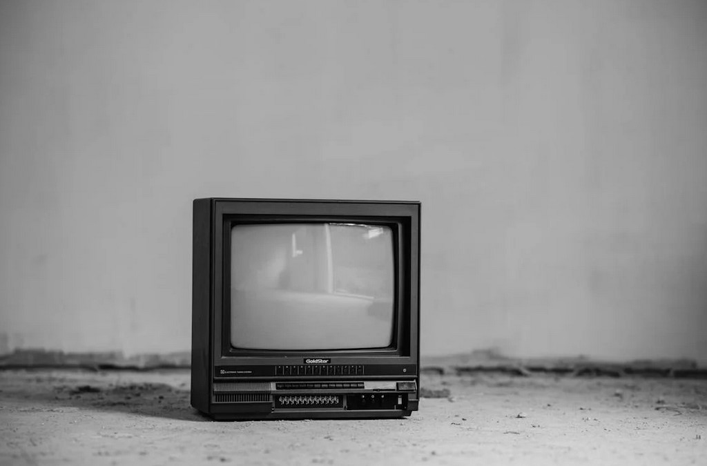 An old discarded television in black and white