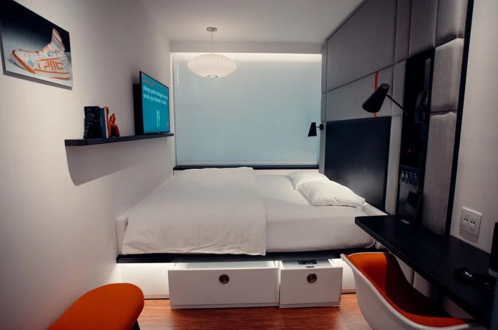 small modern bedroom, bed with large storage base