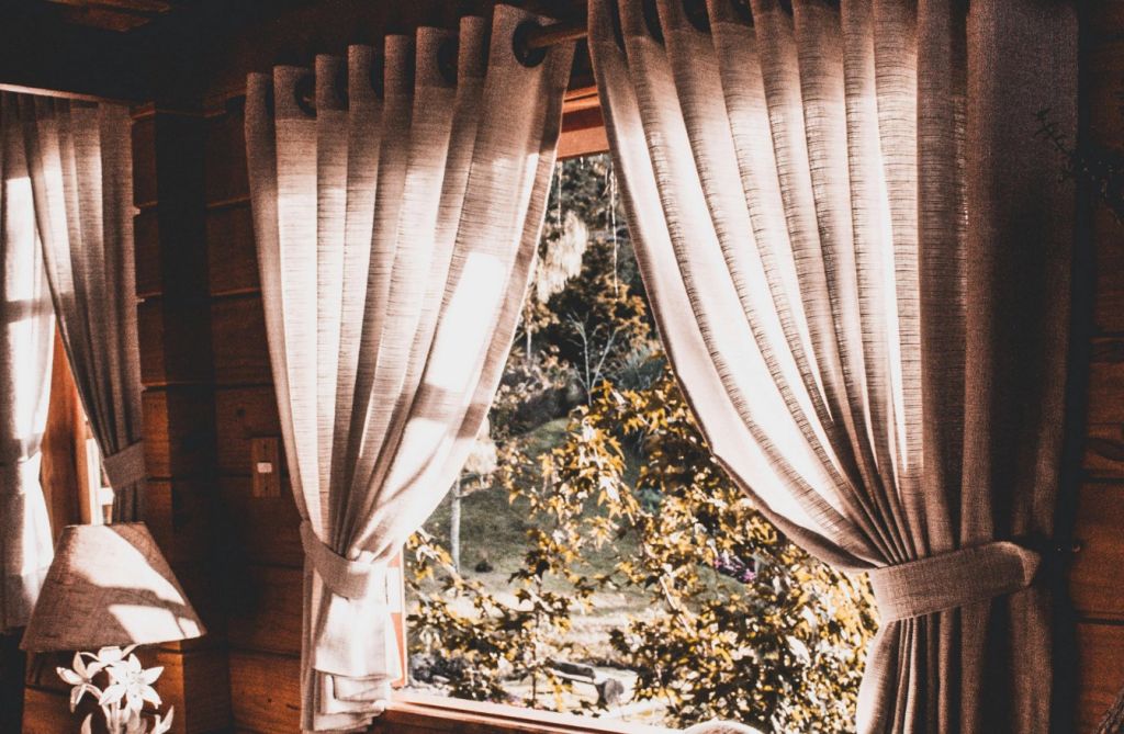 Thick curtains during a warm day, warm lighting
