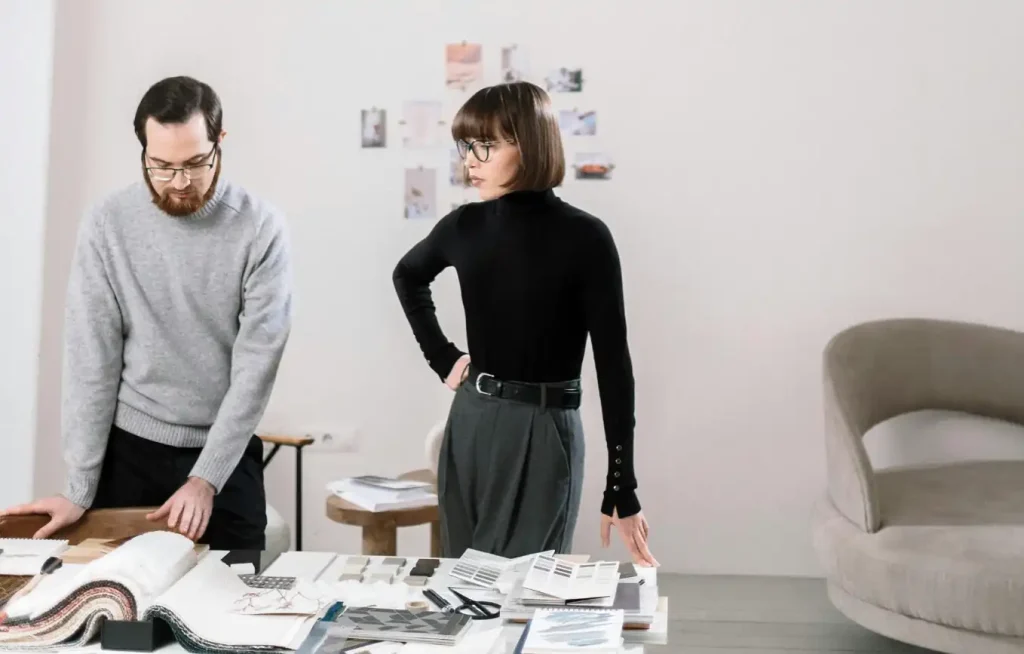 A man and woman selecting styles and designs